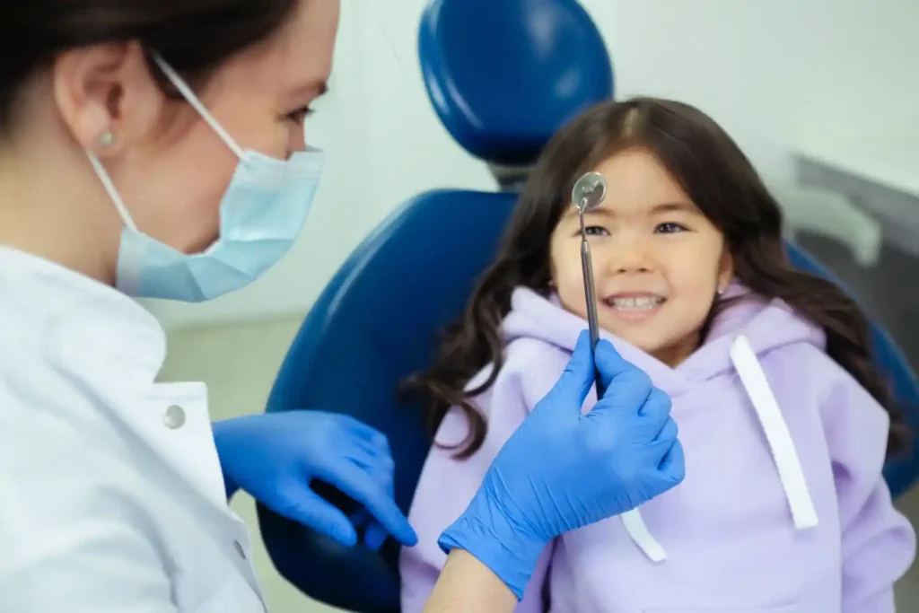 A parent and child at a family dental visit in a bright treatment room